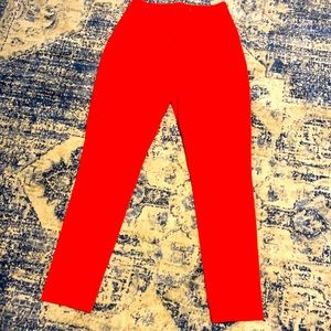 Rich and vibrant orange pants by ASOS.